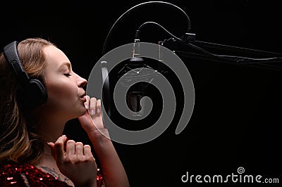 Singer or radio host blogger working in a professional studio. Recording a soundtrack, album, working with a label Stock Photo