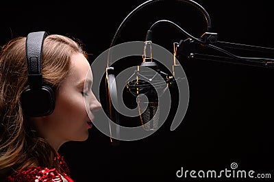 Singer or radio host blogger working in a professional studio. Recording a soundtrack, album, working with a label Stock Photo