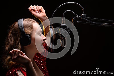 Singer or radio host blogger working in a professional studio. Recording a soundtrack, album, working with a label Stock Photo