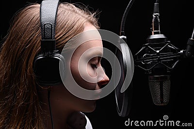 Singer or radio host, voice acting for films or blogger, audio book in the process of work, recording a track Stock Photo