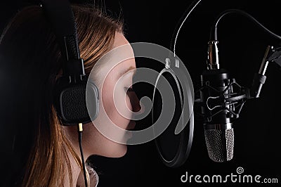 Singer or radio host, voice acting for films or blogger, audio book in the process of work, recording a track Stock Photo