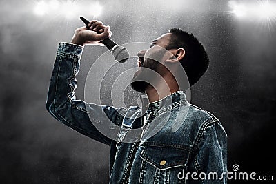 Singer singing song with microphone wireless Stock Photo