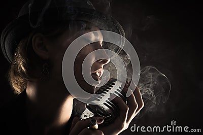 Singer woman with retro microphone Stock Photo
