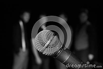 Singers behind a mic Stock Photo