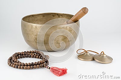 Singing Bowl, Prayer Beads and Meditation Bells. Stock Photo