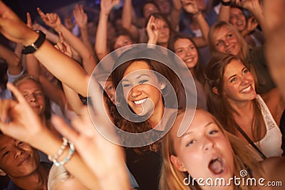 Singing every word to the song. Attractive female fans enjoying a concert- This concert was created for the sole purpose Editorial Stock Photo