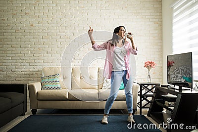 Singing in the living room Stock Photo