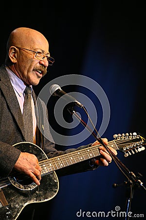 Singing performer author, poet, singer, musician, actor, guitarist and composer Alexander Rosenbaum. Editorial Stock Photo