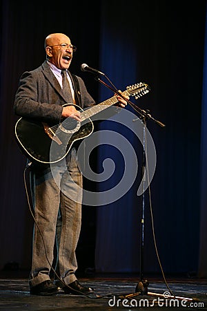 Singing performer author, poet, singer, musician, actor, guitarist and composer Alexander Rosenbaum. Editorial Stock Photo