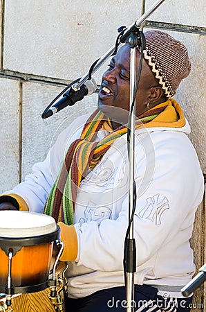 Singing and playing percussion Editorial Stock Photo