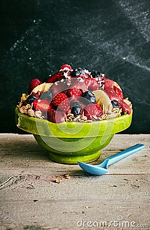 Single acai bowl of cereal and fruit on old table Stock Photo