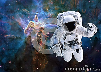 Single astronaut near Mystic Mountain of Carina Nebula Stock Photo