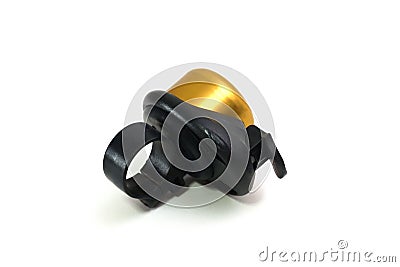 A single bicycle ringer bell with black loop ring and gold painted surface Stock Photo