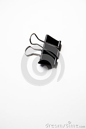 Single binder clip over white background Stock Photo