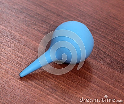 Single blue medical enema Stock Photo