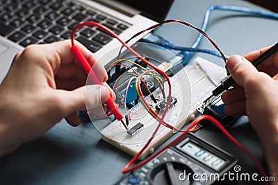 Single board microcontroller testing close-up Stock Photo