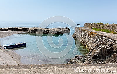 Single boat in small harbour Stock Photo