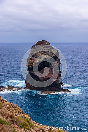 Single boulder in the atlantic ocean at the shore of the peninsula Ponta do Sao Lourenco, Madeira Stock Photo