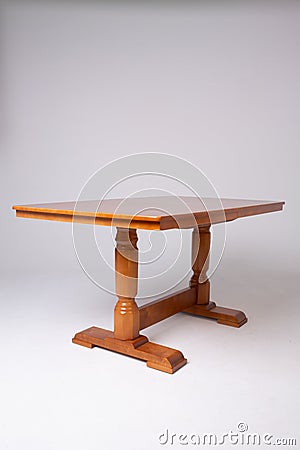 Single brown table with empty surface and carved legs on an isolated Stock Photo