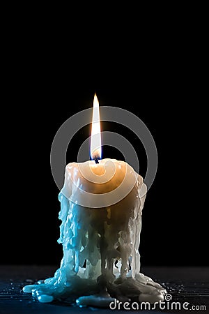Single burning candle Stock Photo