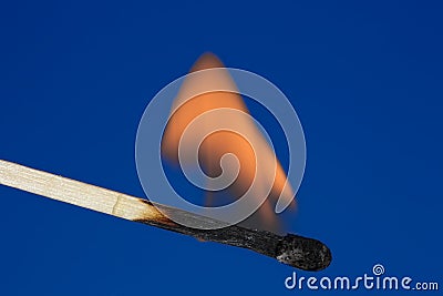 Single burning match Stock Photo