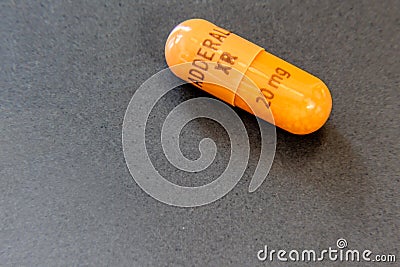 Single Capsule of the Stimulant Adderall XR, 20 mg Editorial Stock Photo