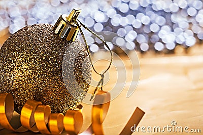 Single christmas ball and gold colored ribbon horizontal version Stock Photo