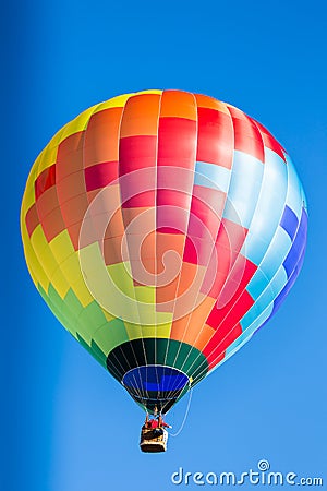 Single colorful hot air balloon in flight Stock Photo