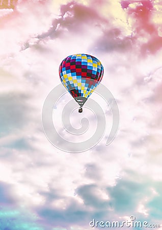 Single, colorful hot-air balloon high in the sky Stock Photo