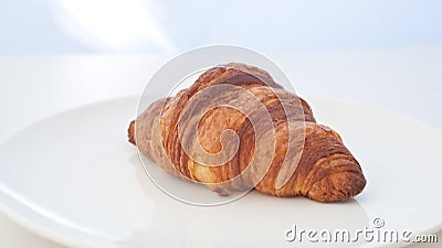 Single croissant in white background Stock Photo