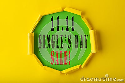 11.11 Single day sales. Yellow circle torn paper with 11.11 Single days sale on Green color background Stock Photo