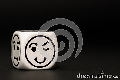 Single emoticon dice with blinking expression sketch Stock Photo