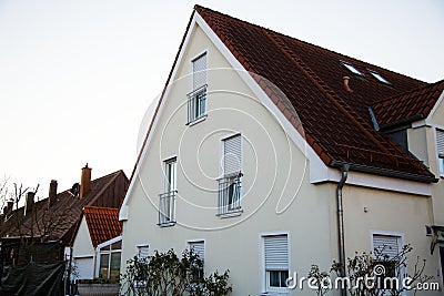 Single family house in Munich, blue sky, white facade Stock Photo