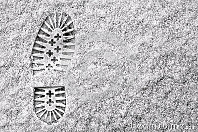 Single footprint in snow Stock Photo