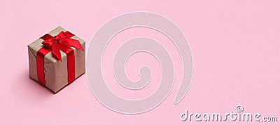 Single gift box on pink solid background. Sale concept. Long horizontal banner photo format. Stock Photo
