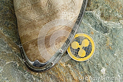 Single Ripple cryptocurrency coin on the floor Editorial Stock Photo