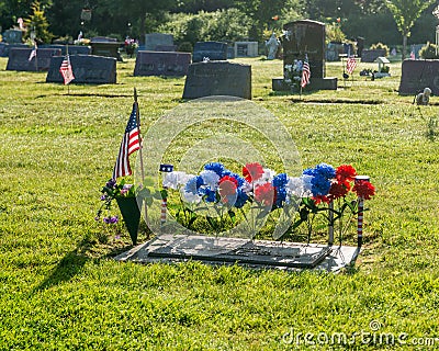 Single grave with American Flag Stock Photo