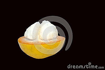 Single Half peeled Cotton fruit or santol Sandoricum koetjape isolated on black background. Stock Photo