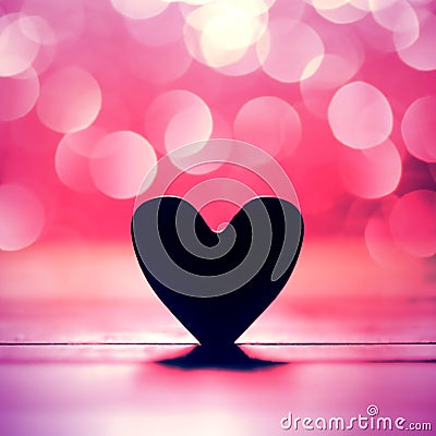 Single heart and bokeh abstract background Stock Photo