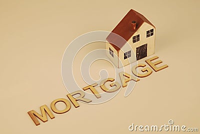 Single home with the word mortgage displayed Stock Photo