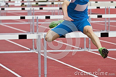 Single hurdle runner Stock Photo