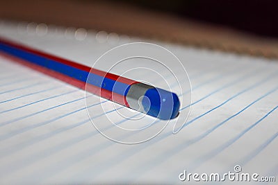 Single isolated pencil over a scribbling pad Stock Photo