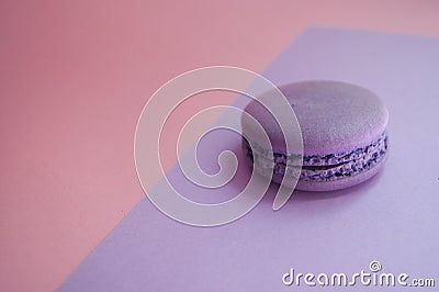 Single macaroon on colorful background. Stock Photo