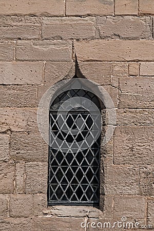 Single medieval castle stained glass window detail close up view Stock Photo