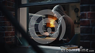 Single-Minded Professional Programmer Obsessively Writing a Code on His Desktop Computer, Late at Stock Photo