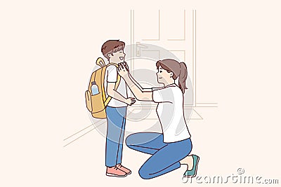 Single mother prepares young son of student in elementary school as trip to lessons Vector Illustration