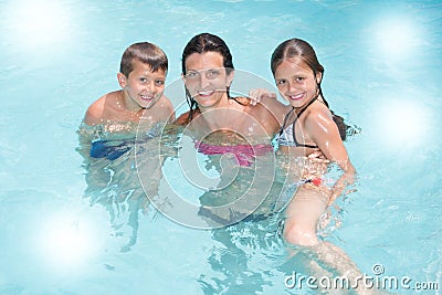 Single mother with son and daughter play in pool summer Stock Photo
