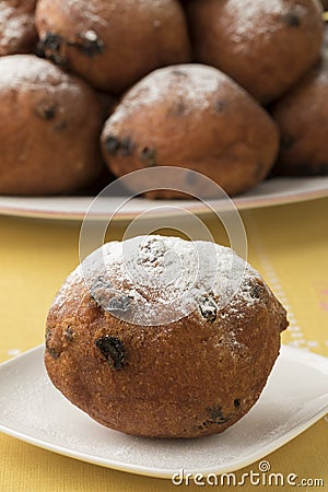 Single oliebol, traditional Dutch pastry for New Year`s Eve Stock Photo