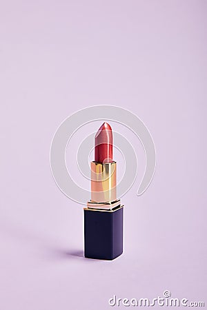 Single opened tube of red lipstick Stock Photo