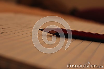 Single pencil over a scribbling pad Stock Photo